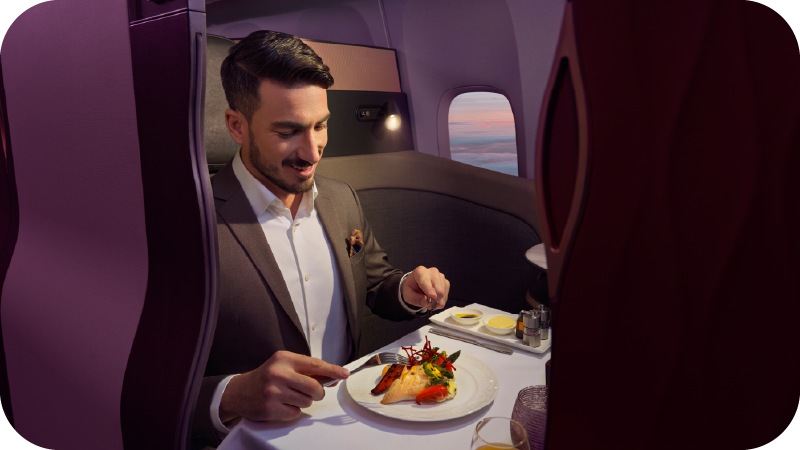 A man having dinner in a plane
